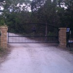 Entry Iron gate with arched top and columns