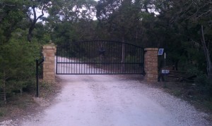 Entry Iron gate with arched top and columns